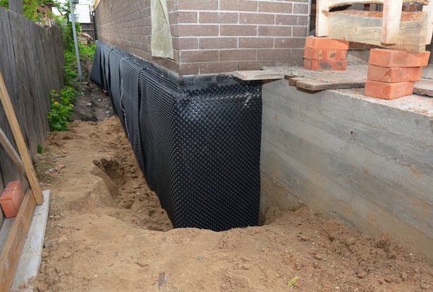 Happy homeowners after waterproofing job in New Hudson